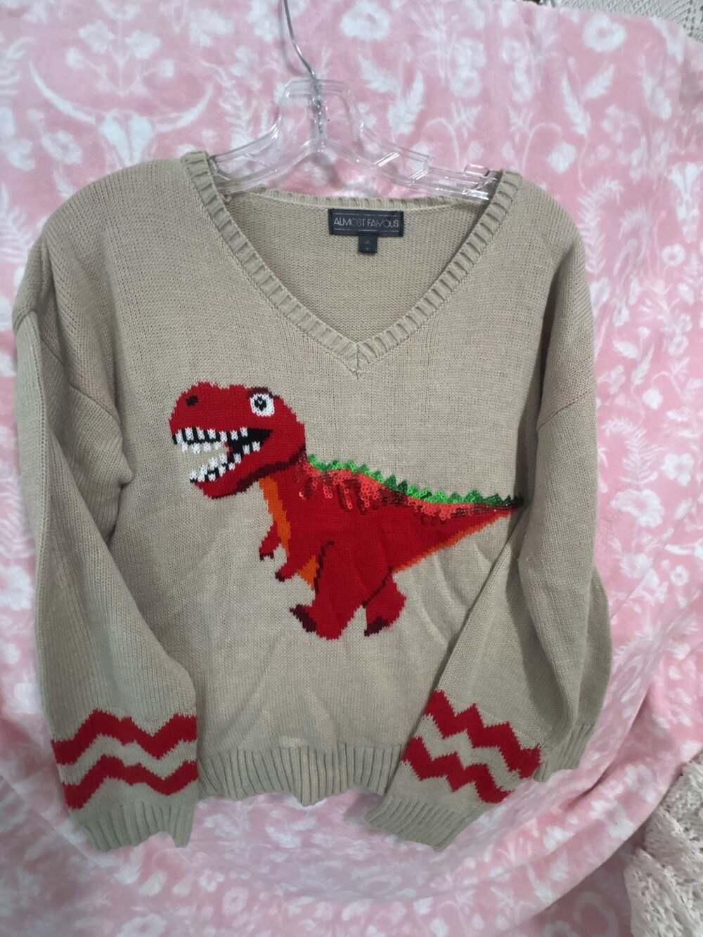 Almost Famous Beige V-Neck Sweater with Sequin Dinosaur Graphic